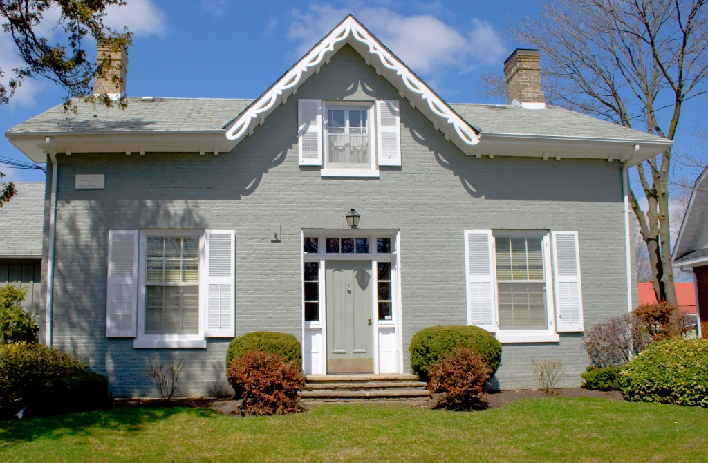 Family standing outside a home during the home buying process
