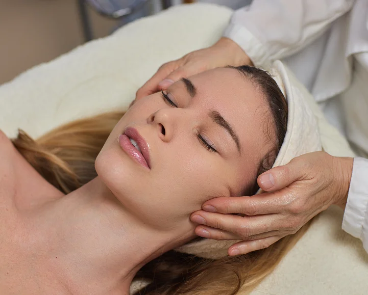 Releasing deep jaw tension during a facial at Parm's Wellness Spa