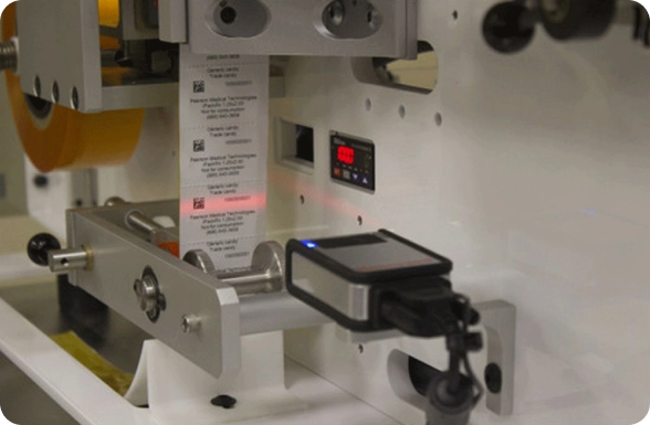 Technician operating the iPack® Rx Unit Dose Packager in a pharmacy.