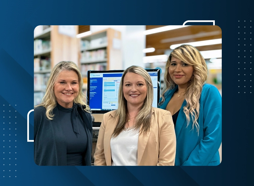Pharmacy professionals discussing pharmacy automation solutions in a healthcare facility.