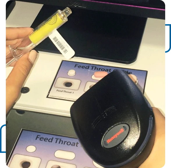 Hospital pharmacy team monitoring automated medication packaging solutions.