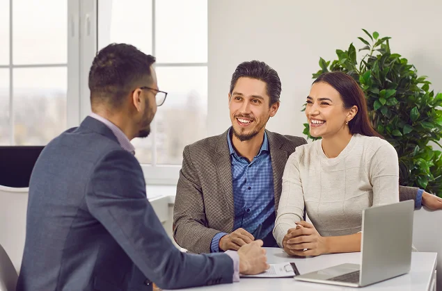 Clients discussing immigration services with a professional advisor