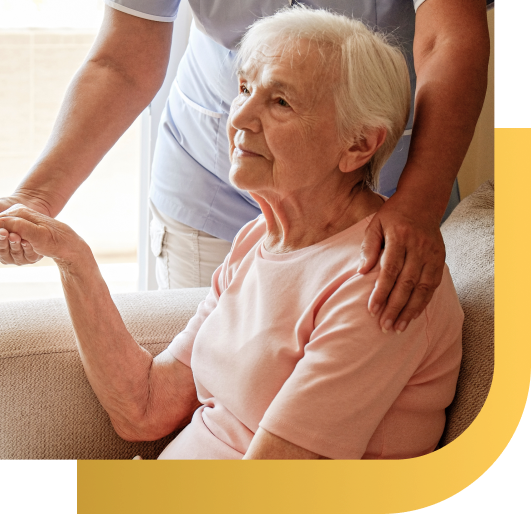 End-of-life doula holding senior hand