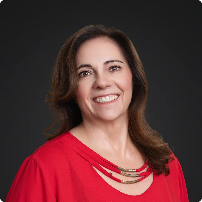 A lawyer smiling during business headshots at the studio.
