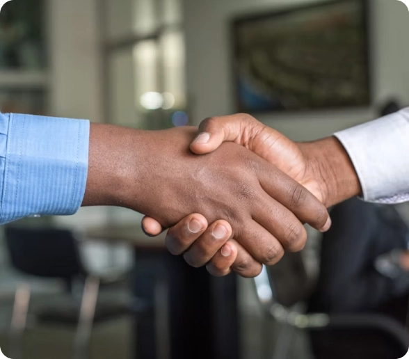A senior advisor shaking hands with a founder