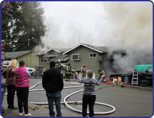 Fire damage repair specialists replacing damaged framing and drywall.
