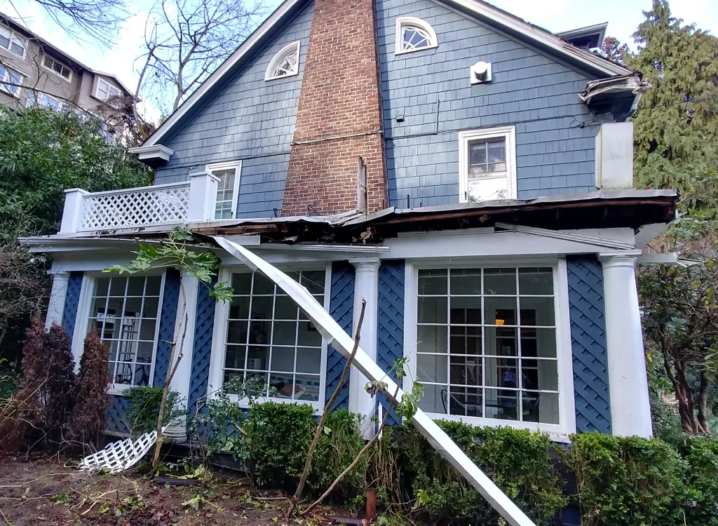 Tree damage repair in Seattle, WA, after a large tree struck a home.