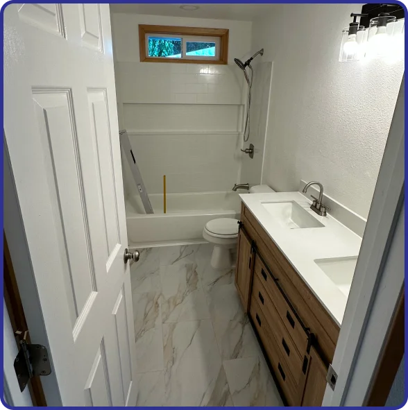 Homeowners reviewing bathroom remodeling plans with experienced contractors.
