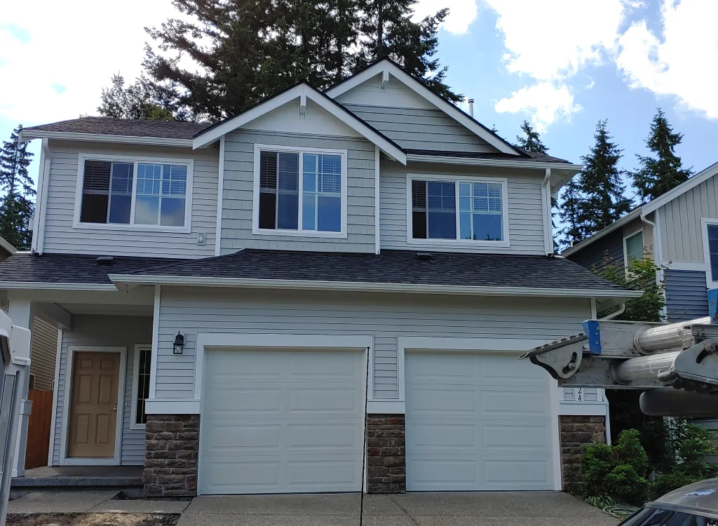 Roof repair services in Seattle, WA, restoring a storm-damaged roof.
