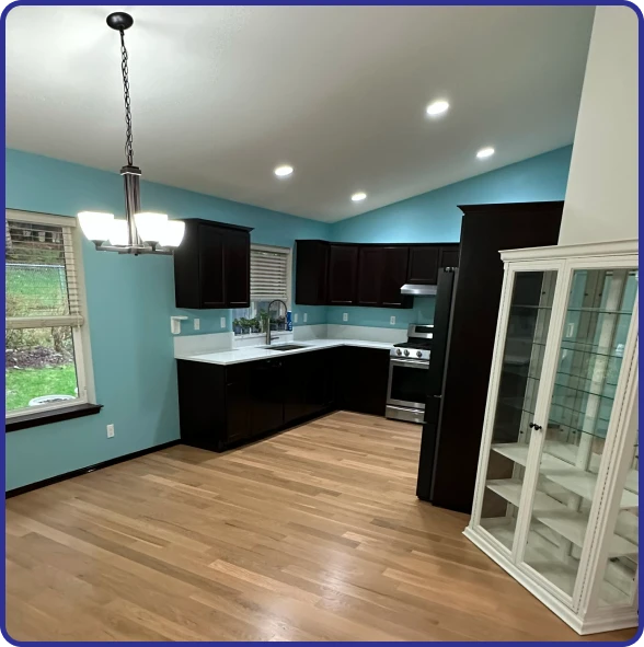 Kitchen repair company replacing damaged cabinets after water damage.
