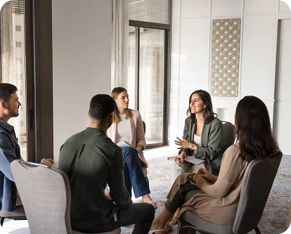 Adult speaking openly with a therapist during therapy services in Toronto