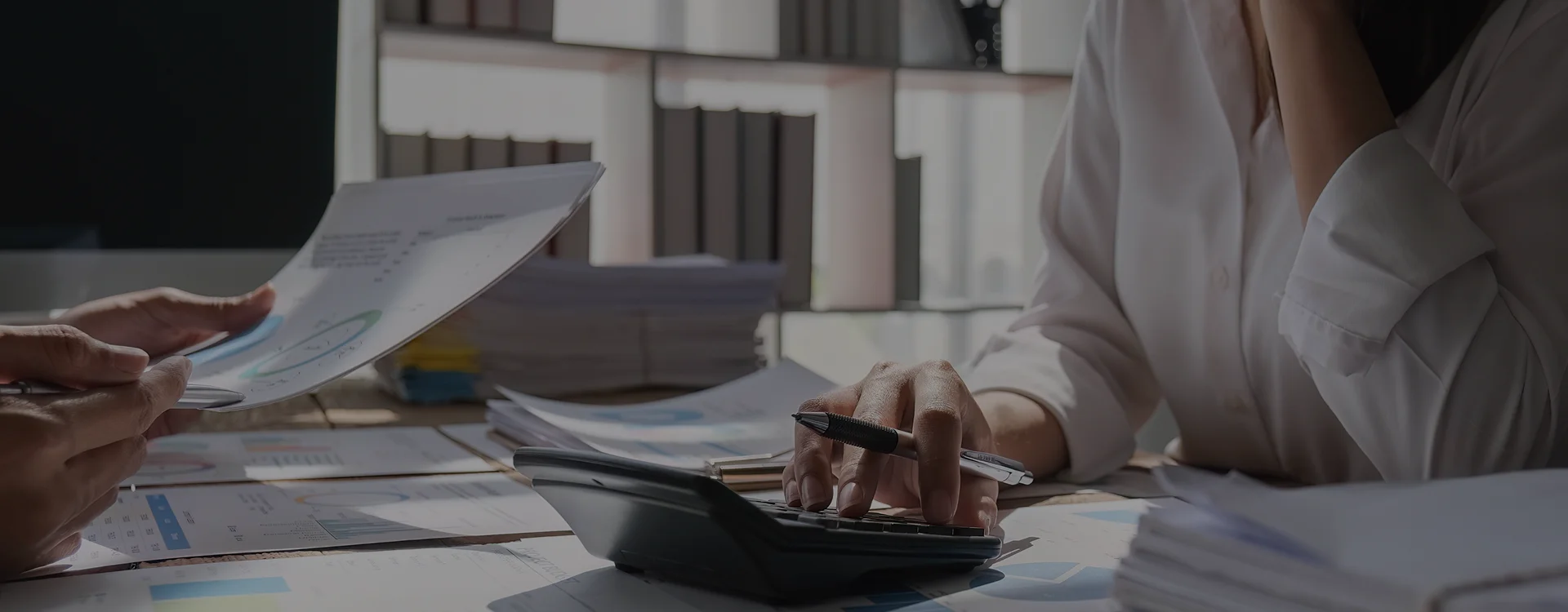 Bookkeeper reviewing account statements for bookkeeping services