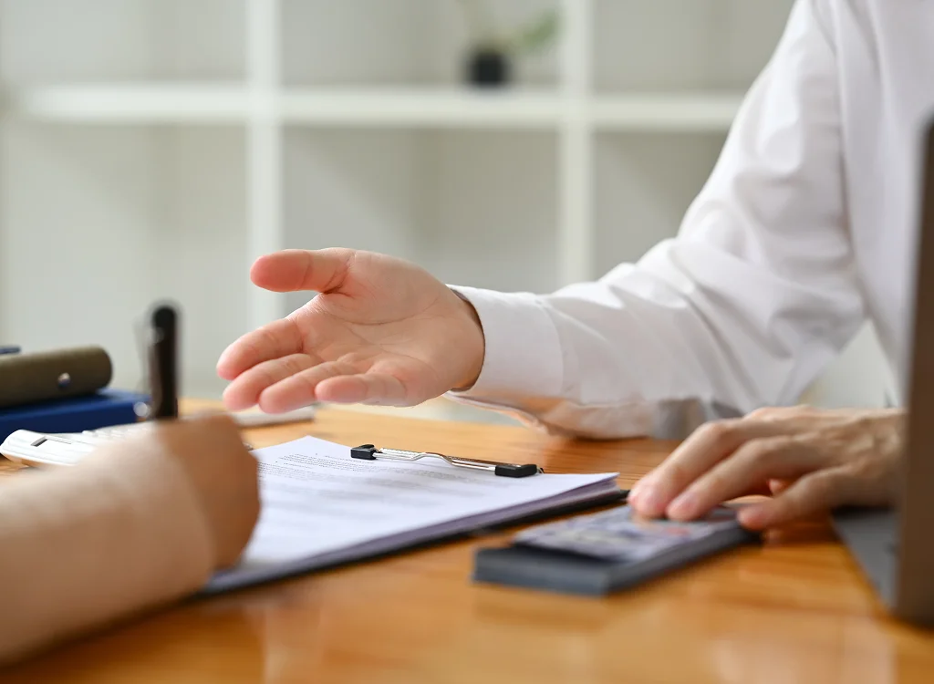 Payroll specialist reviewing employee records for payroll services