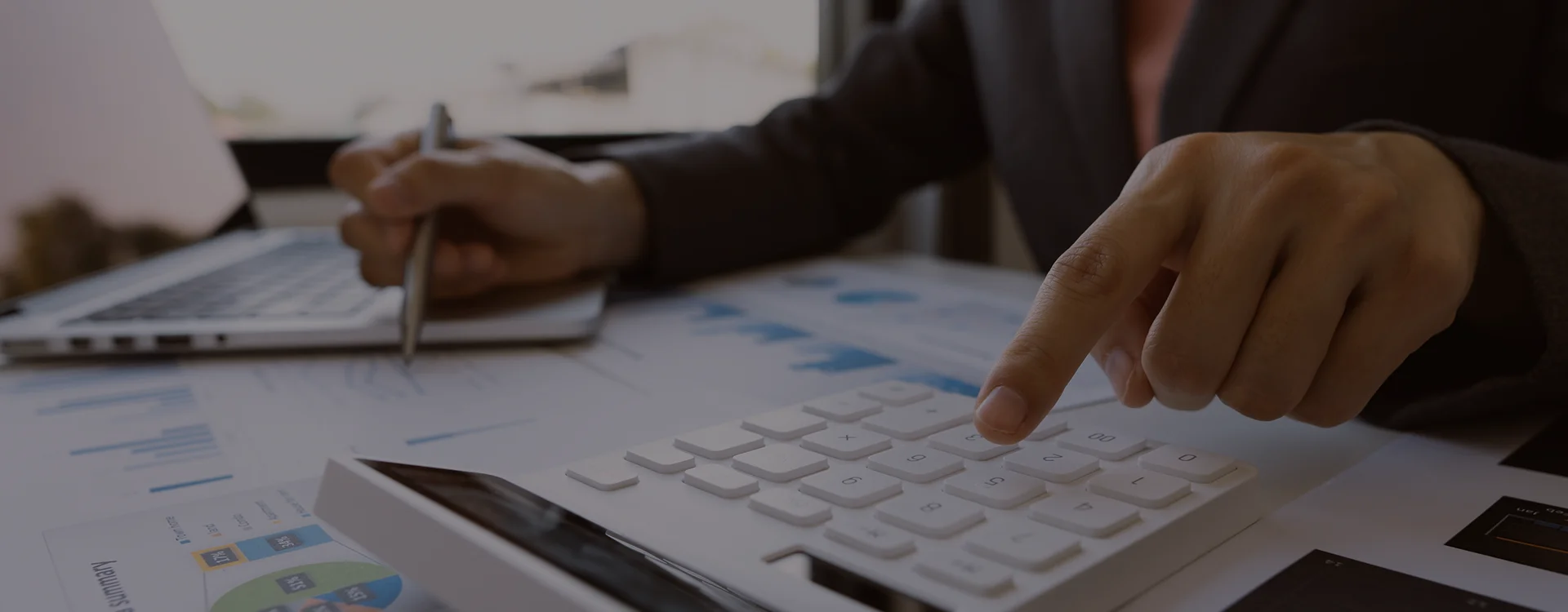 Bookkeeper reviewing disorganized records for bookkeeping cleanup services
