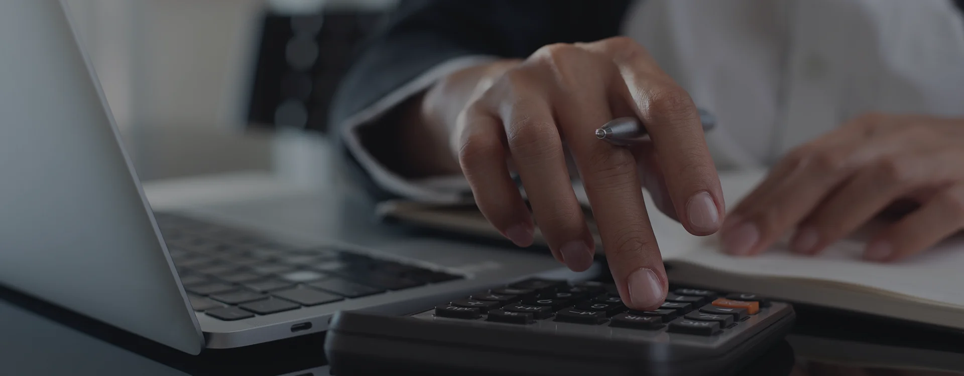 Accountant reviewing reports for manufacturing bookkeeping services