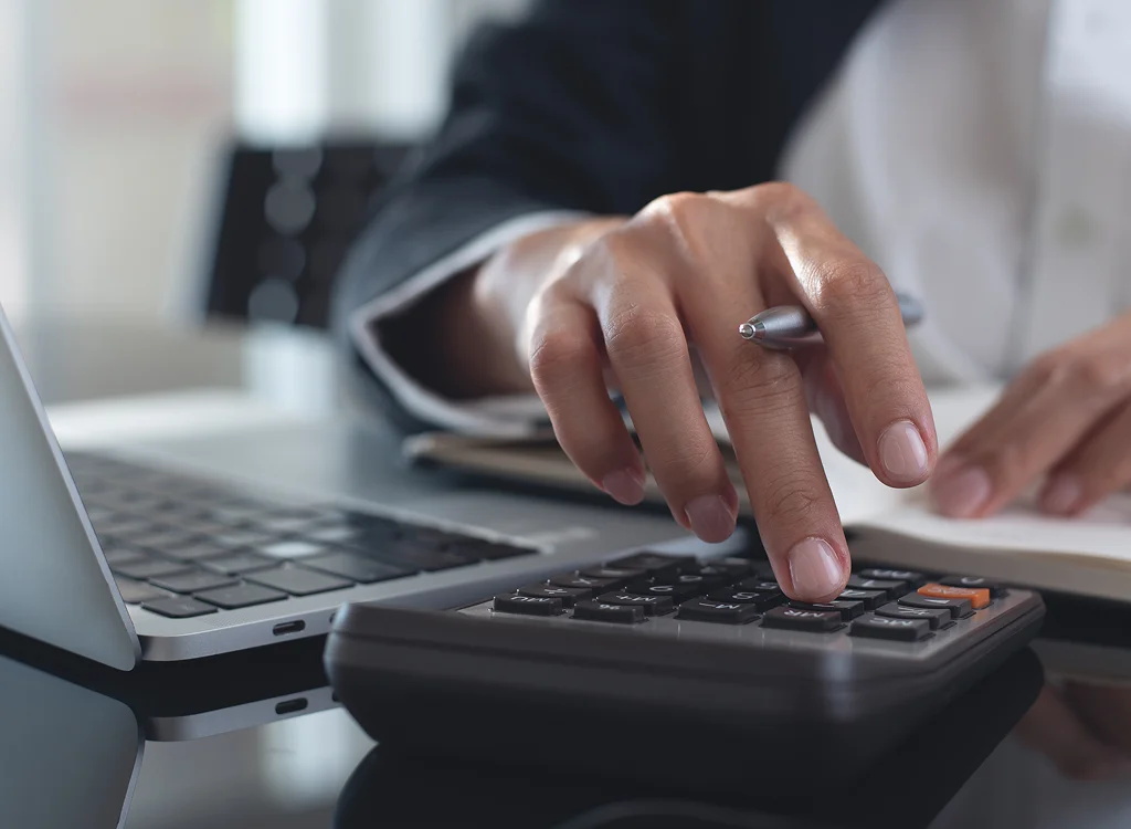 Accountant reviewing reports for manufacturing bookkeeping services

