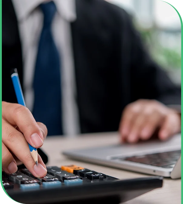 Accountant reviewing costs for manufacturing bookkeeping services in Loveland