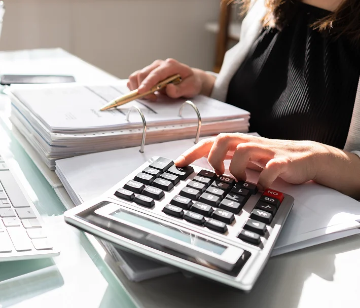 Small business bookkeeper reviewing financial records