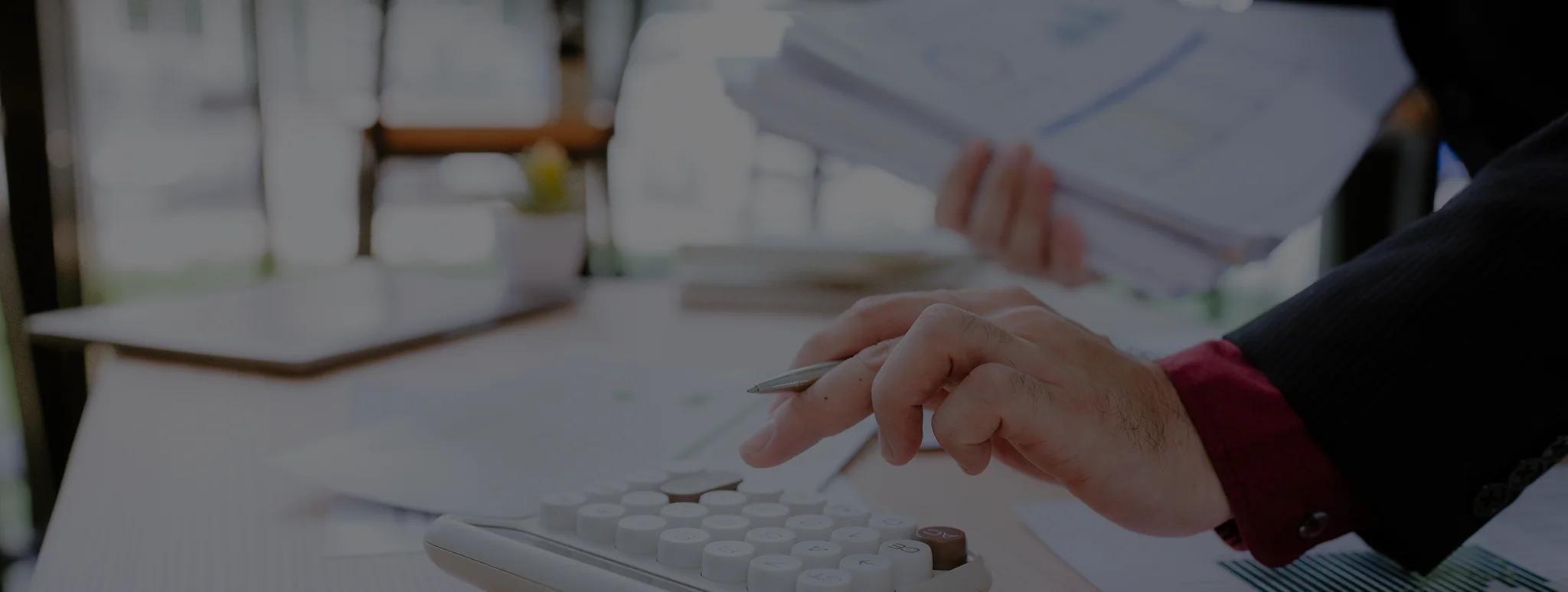 Bookkeeper reviewing invoices for accounts receivable services