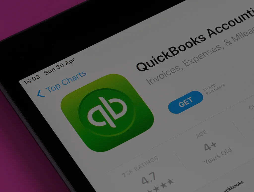 Bookkeeper using a laptop for QuickBooks bookkeeping services