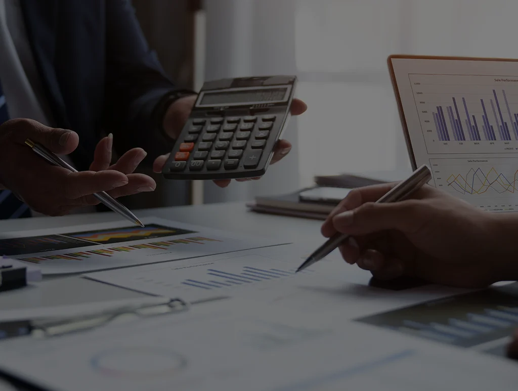 Bookkeeper reviewing business reports for financial reporting services