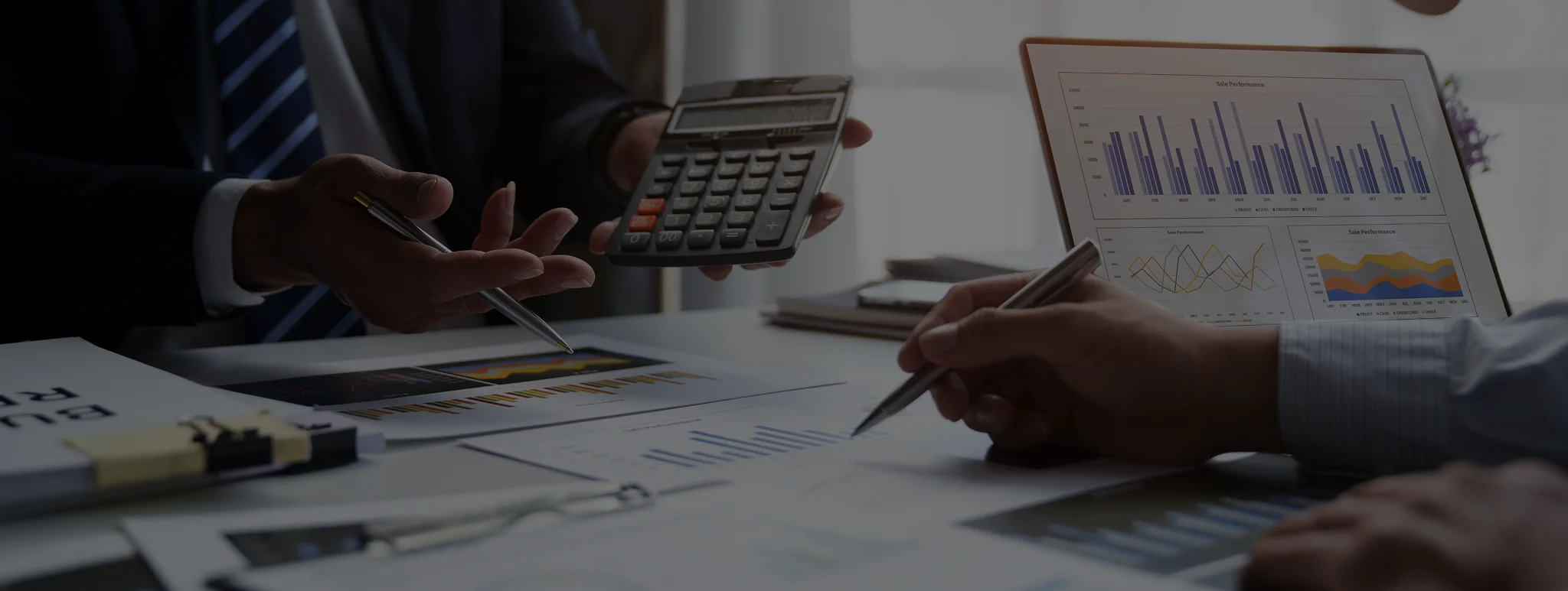 Bookkeeper reviewing business reports for financial reporting services