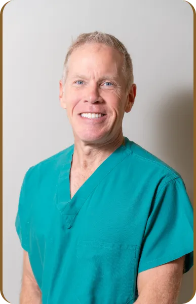 Orthopedic surgeon expert witness reviewing medical records at a desk